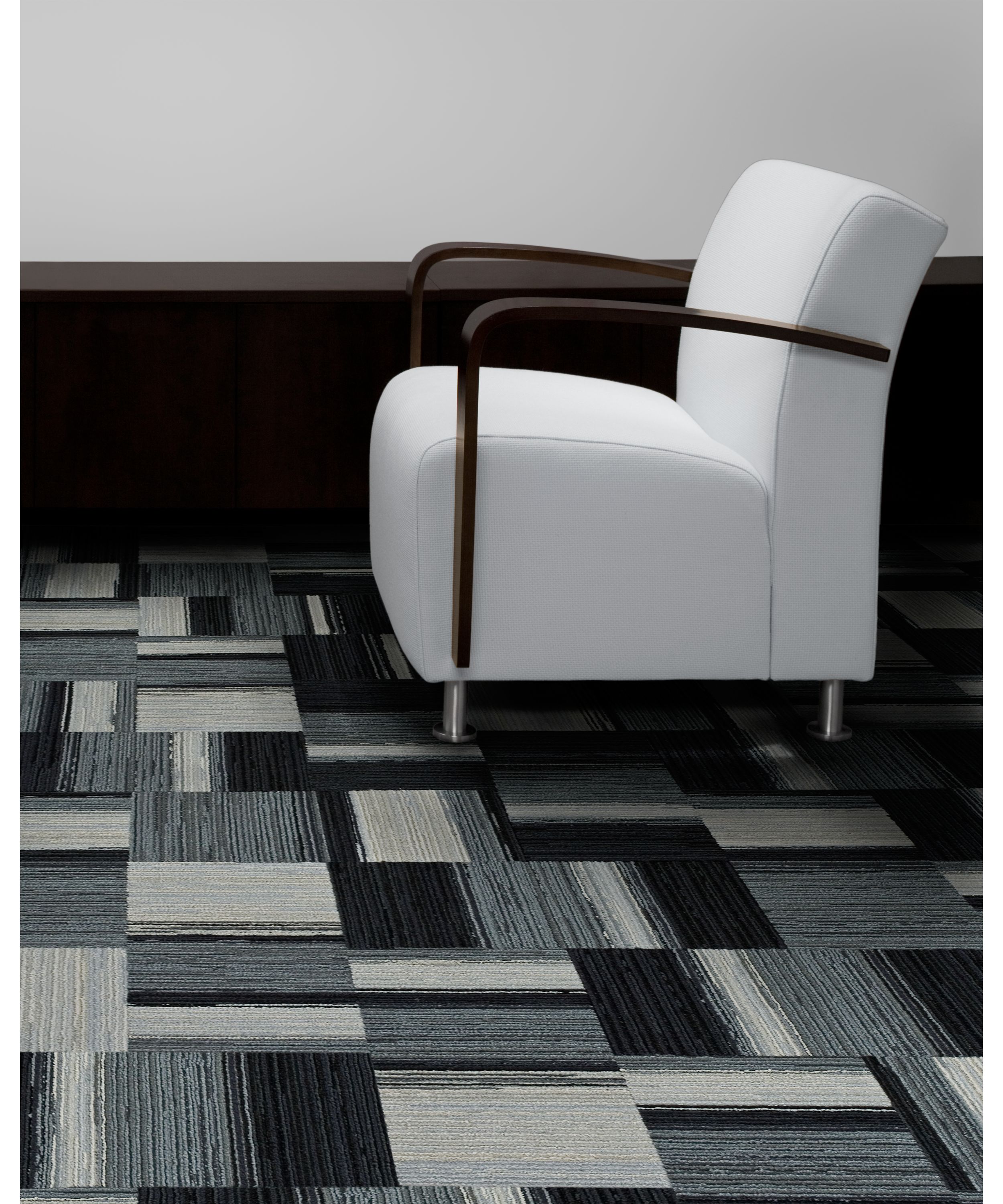 Interface Across the Board carpet tile in seating area with white chair image number 4
